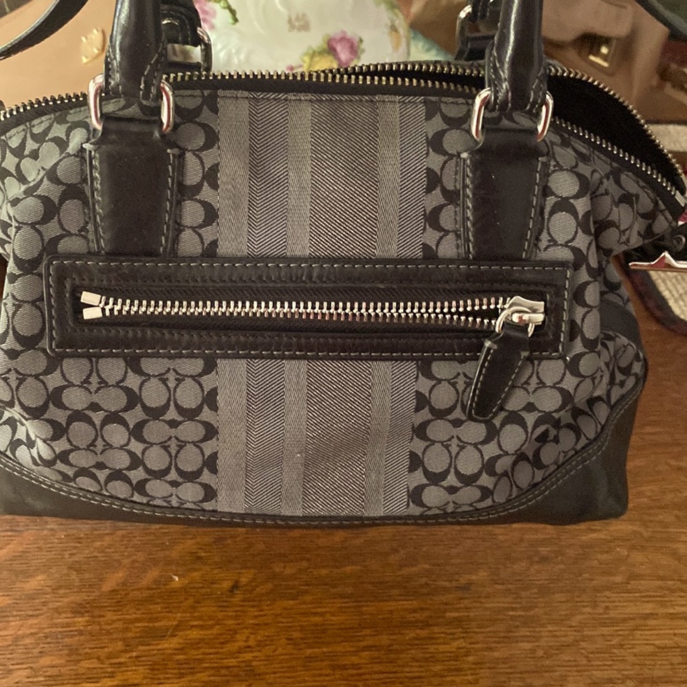 Gray and black coach signature satchel.